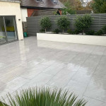 Paved garden with planted border